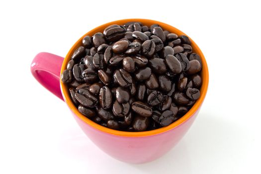 coffee beans in pink cup