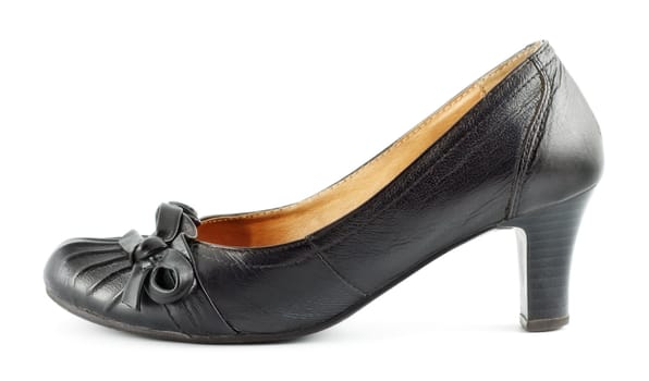 black leather female shoes on grey background