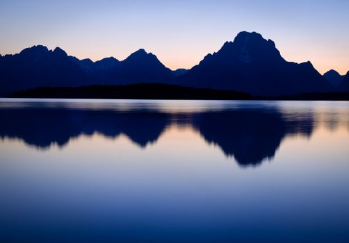 Mount Moran (right) and Jackson Lake on a clear evening in autumn, Grand Teton National Park, Wyoming, USA