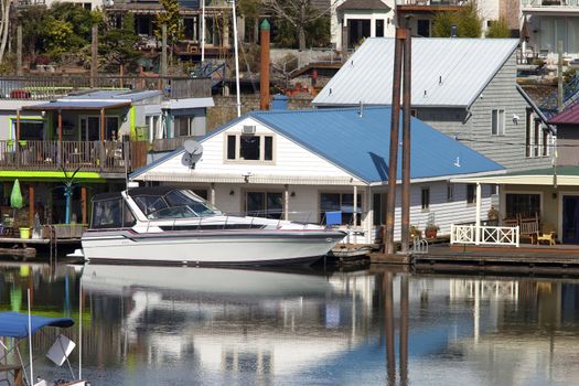 Two level floating house and a power boat, Portland OR.