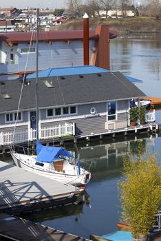 Floating homes and sailboats parked in front, Portland OR.