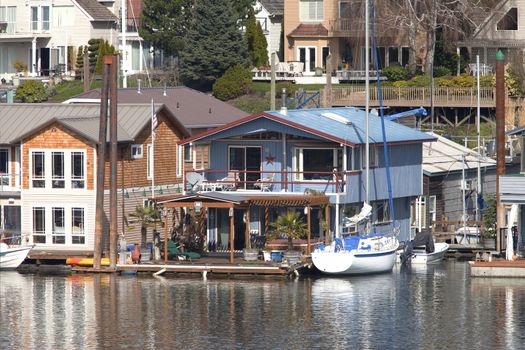 Two level floating house and a power boat, Portland OR.