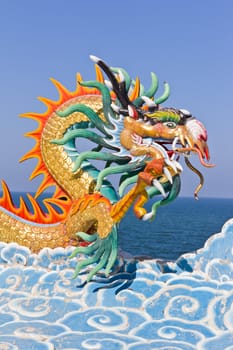 dragon statue against blue sky in chinese temple