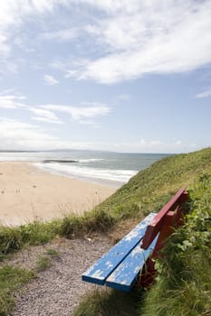 ballybunion bench in summer with view of castle beach and cliffs