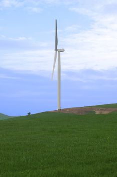 windmill on lush irish countryside landscape in glenough county tipperary ireland