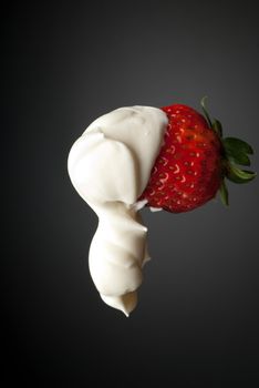 Red strawberry cream isolated on gray side lighting