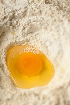 Macro shot of an egg flour volcano