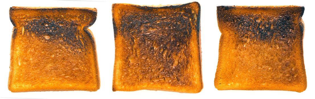 close up of burnt toast on white
