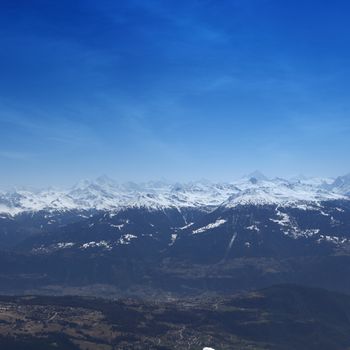 top of mountains sun in blue sky