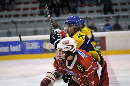 ZELL AM SEE; AUSTRIA - AUG 30: Austrian National League. Number 21 of KAC II got a hit by a player of Zell am See. Game EK Zell am See vs KAC II (Result 2-3) on August 30, 2011 in Zell am See.