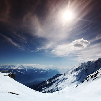 top of mountains in blue sky