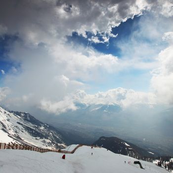 top of mountains sun in blue sky