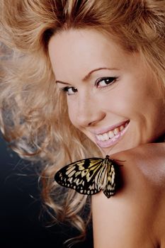 woman and butterfly on black