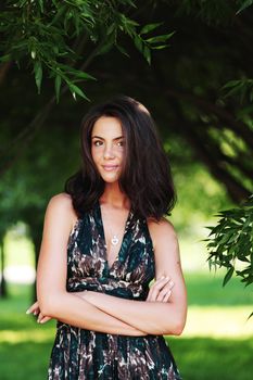 girl on a background of green trees