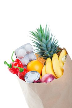 A brown paper bag stuffed with groceries.  Shot on white background.