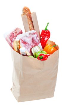 A brown paper bag stuffed with groceries.  Shot on white background.