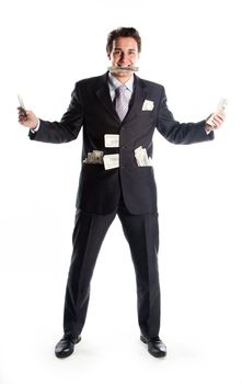 Portrait of a young businessman in a dark suit surrounded by flying dollar bills