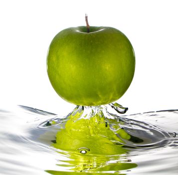 Green apple water splash with white background, high speed splash