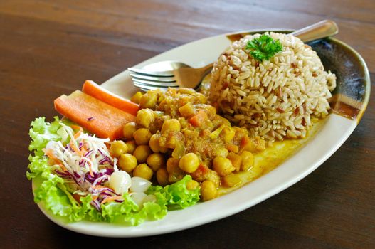 Rice and curry in Japanese style on wooden table