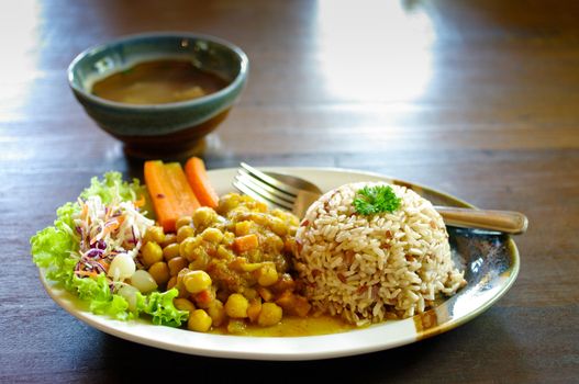 Rice and curry in Japanese style on wooden table