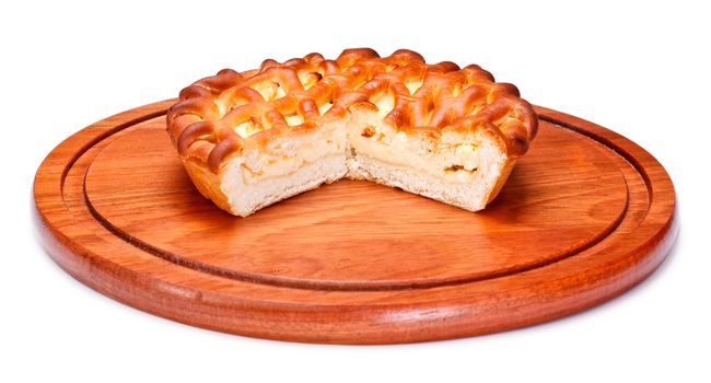 pie with curds on wooden tray, isolated on white