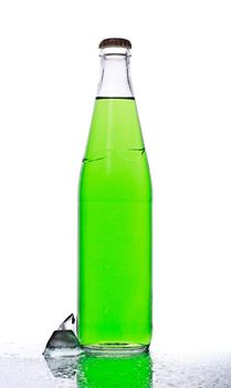 green soda bottle and ice cubes, white background