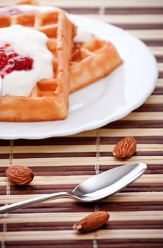 dessert with soft waffle and raspberry jam