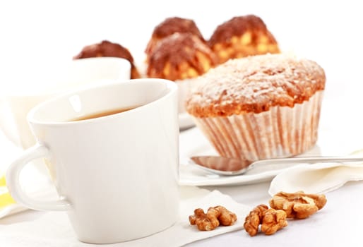 tea with lemon and fancy cakes, still life