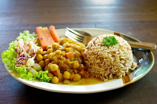 Rice and curry in Japanese style on wooden table