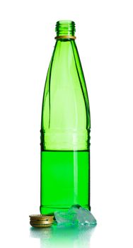 green soda bottle and ice cubes, white background