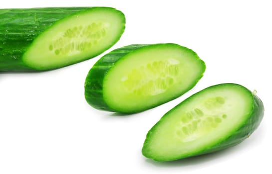 Slices of fresh green cucumber isolated on a white background 