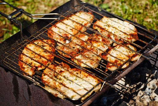 fresh juicy stakes grilling on the barbecue