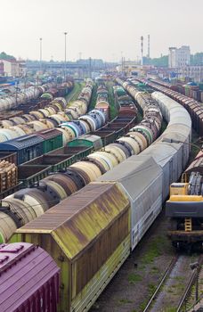 railway station and lot of cargo trains
