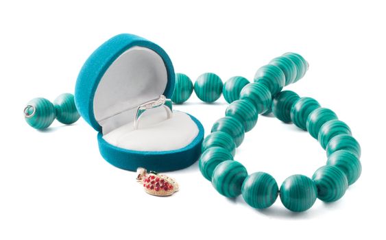 The jewel box with ring and beads isolated on the white background.