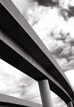 Concrete Railroad bridge towards cloudy sky
