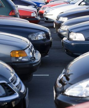 Large group of Parked Cars in a row