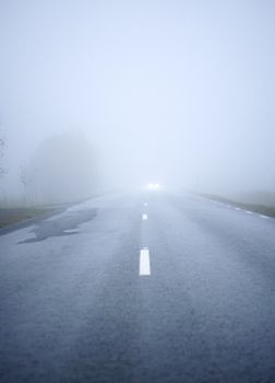 Car driving the Fog Road