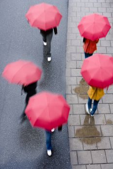 Group of People with Red umbrellas