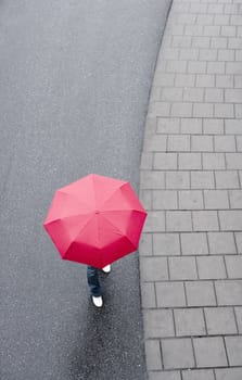 Human with red umbrella from hig Angle view