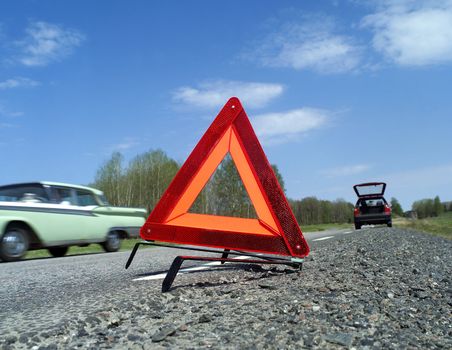 Warning traingle at the side of the road