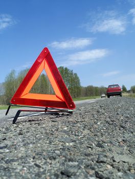 Warning traingle at the side of the road