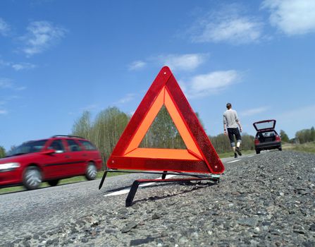 Warning traingle at the side of the road