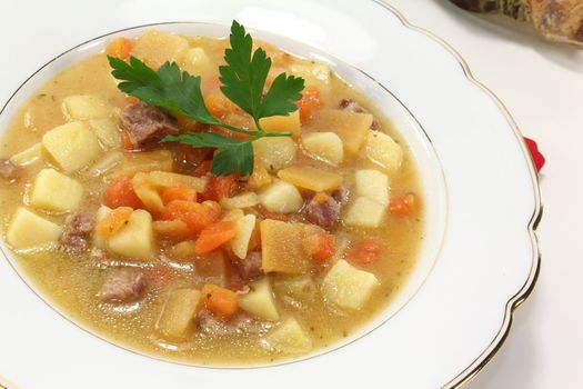 Turnip soup with beef, carrots, potatoes and parsley