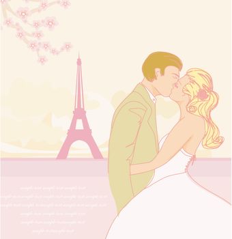 Romantic couple in Paris kissing near the Eiffel Tower.