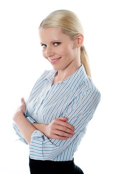 Saleswoman posing in style, arms-folded. Smiling at camera