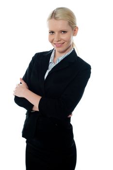 Smiling young femlae CEO posing with folded arms