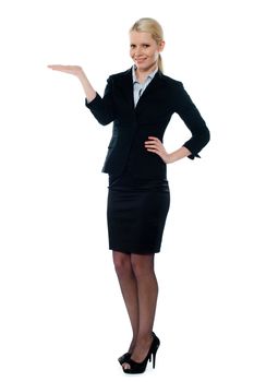 Full shot of female executive posing with open plam isolated over white background