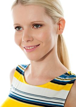 Blond girl smiling and looking away isolated over white background