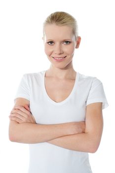 Close-up portrait of skinny teenager smiling with folded arms