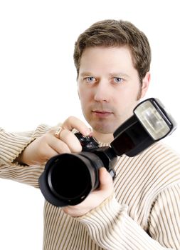 Photojournalist holding camera with flash. Isolated on white.